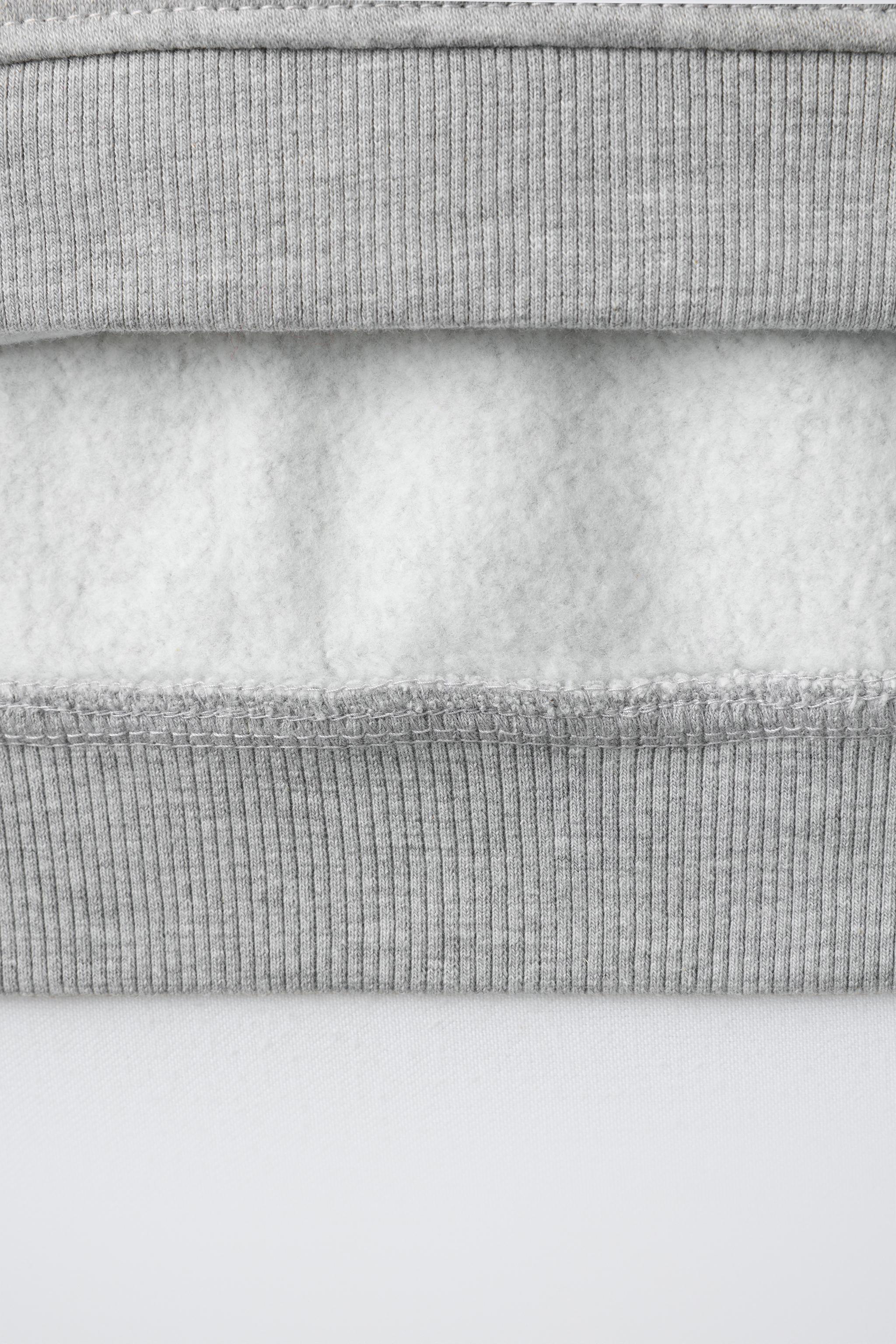 SWEAT À CAPUCHE DÉCOR STRASS