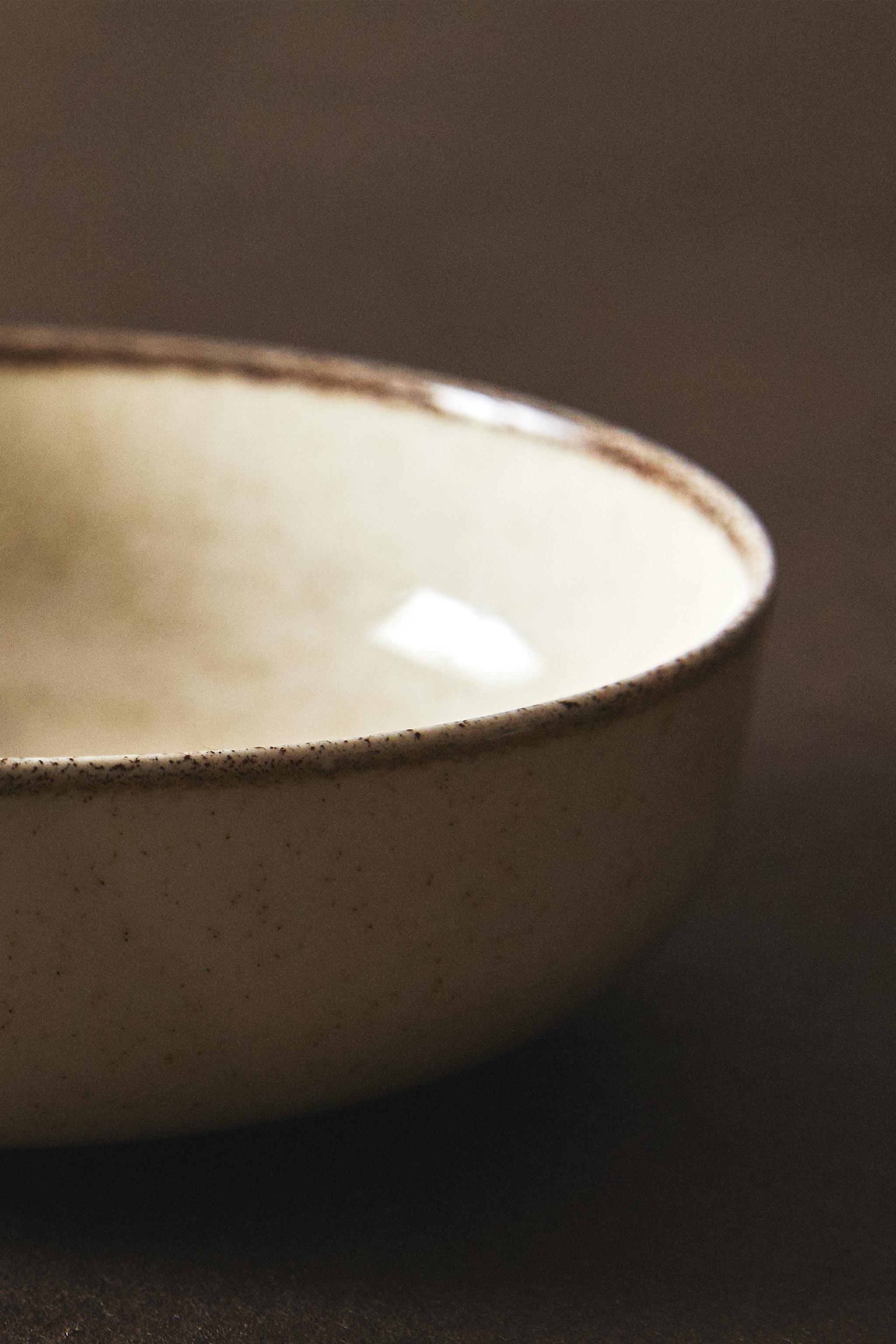 PORCELAIN BOWL WITH ANTIQUE FINISH RIM