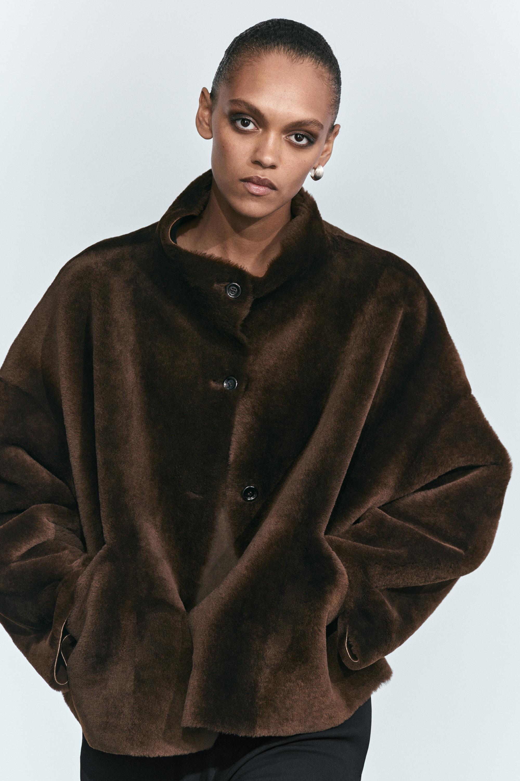 Manteau réversible en cuir avec fourrure