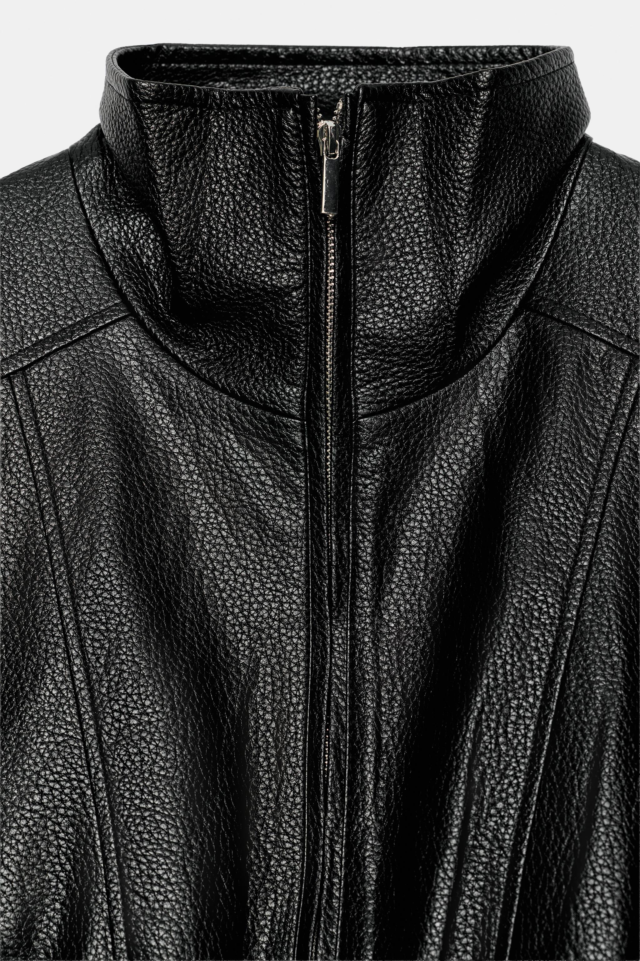 BLOUSON COURT EN MATIÈRE SYNTHÉTIQUE