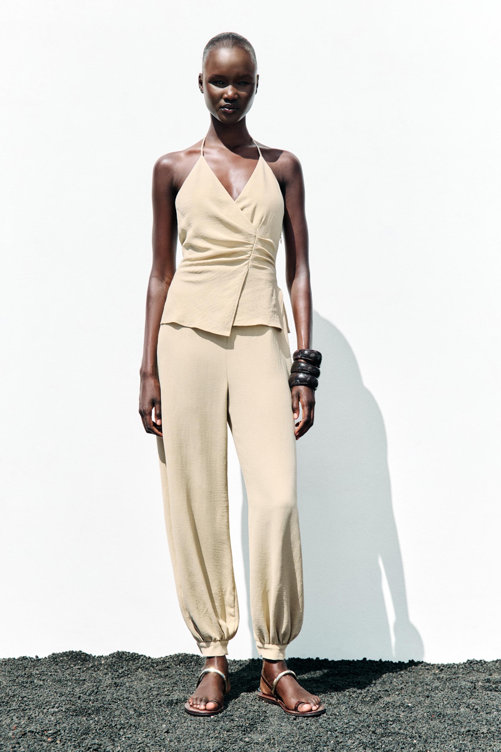 HALTER TWO-PIECE EFFECT JUMPSUIT
