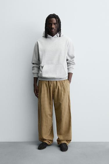 БРЮКИ BALLOON FIT С ЗАЩИПАМИ — ЭКРЮ / ЖЕЛТЫЙ от Zara