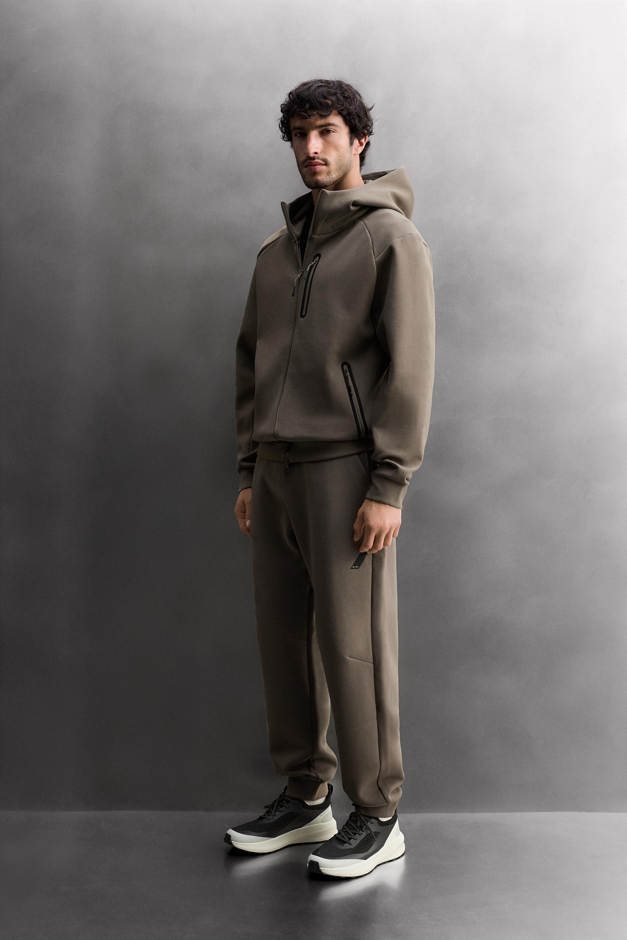 SWEAT TECHNIQUE ZIPPÉ À CAPUCHE