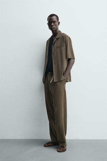 بنطلون منسدل بقصة مريحة - بني/ توبو الخاص بـ Zara