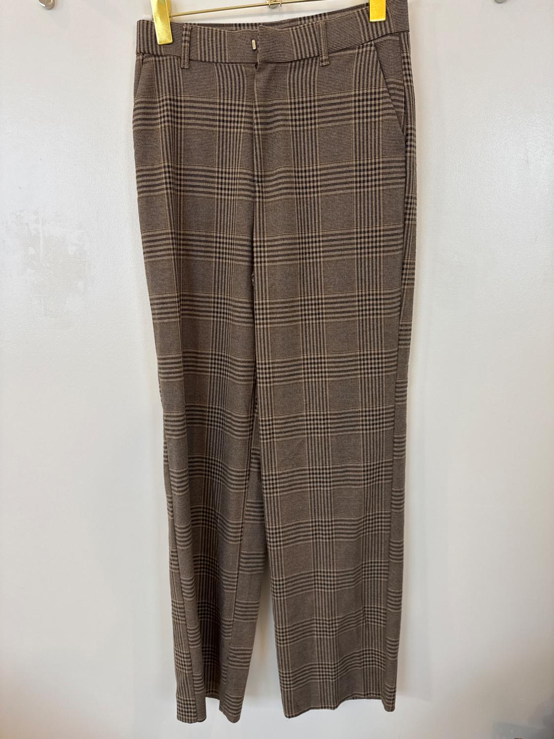 Front view of brown plaid pants with side pockets.