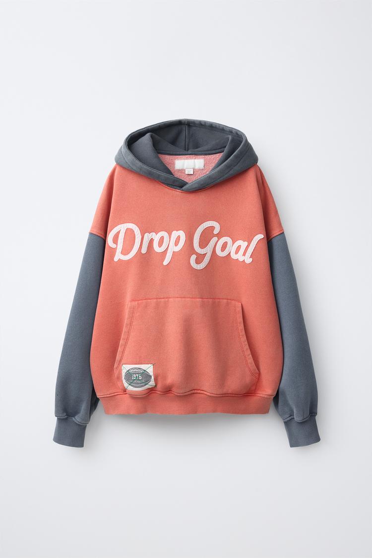 Sudadera capucha colorblock texto