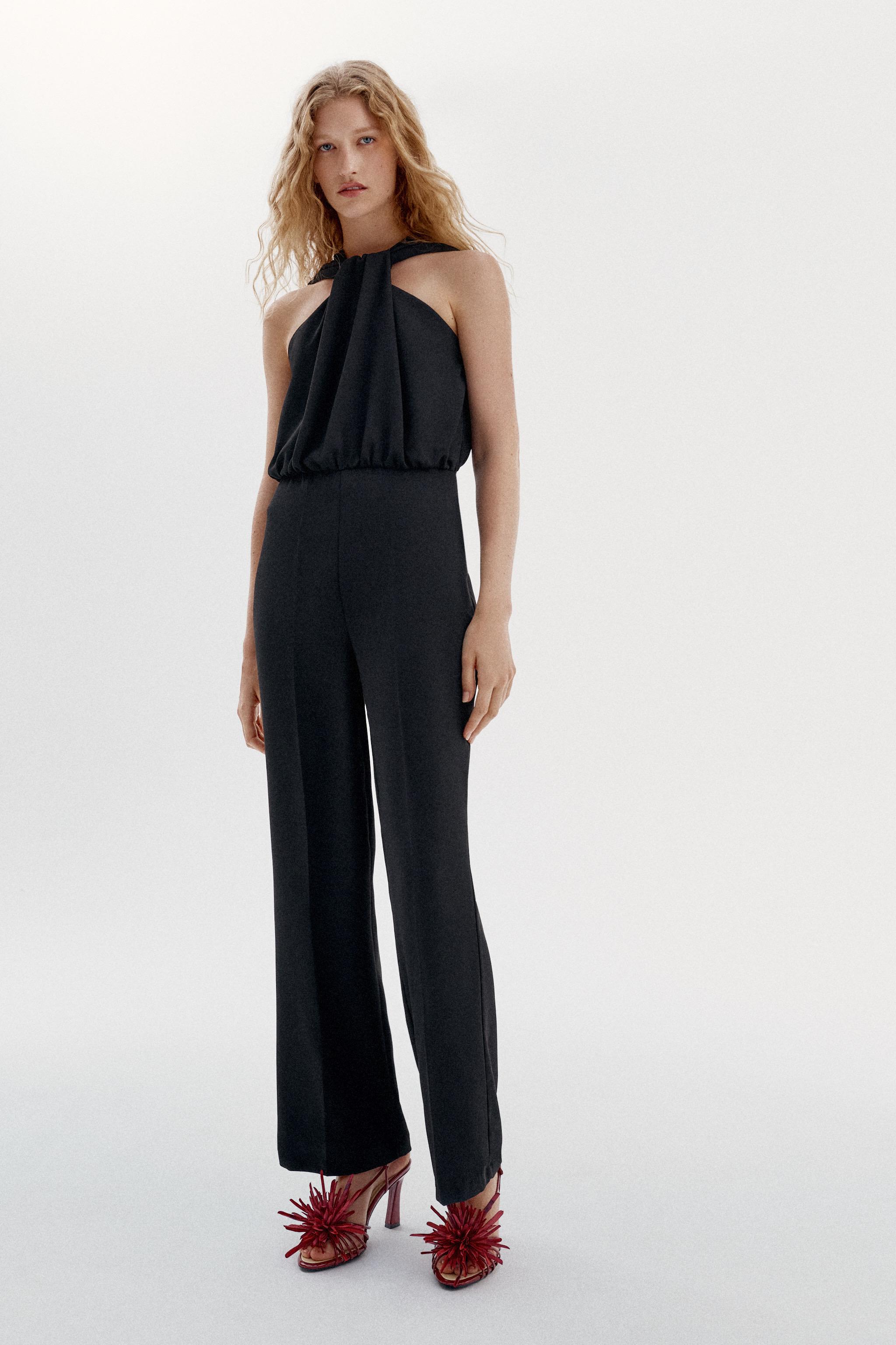TWIST NECK FLARE JUMPSUIT