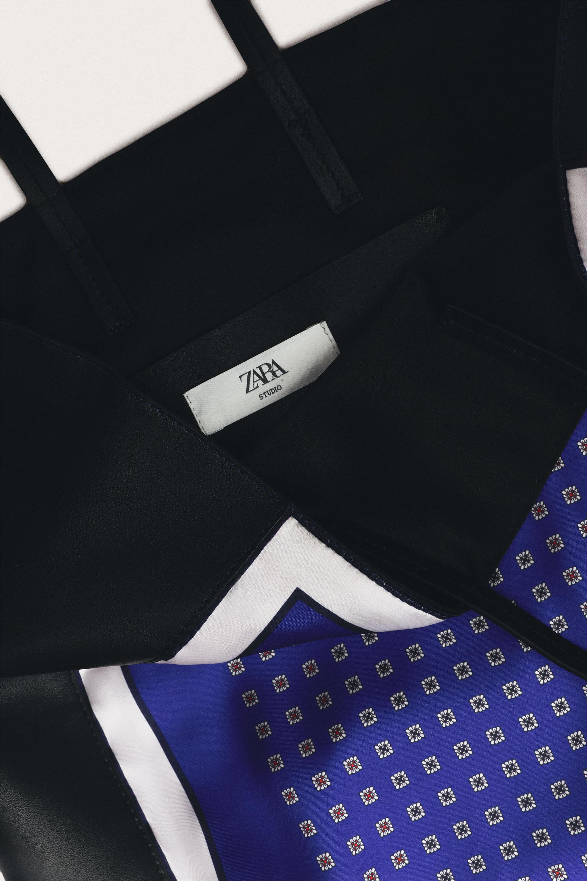 LIMITED EDITION LEATHER DETAIL HANDBAG