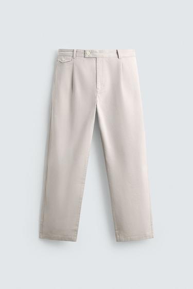 RELAXED FIT PLEATED TROUSERS - Stone by Zara