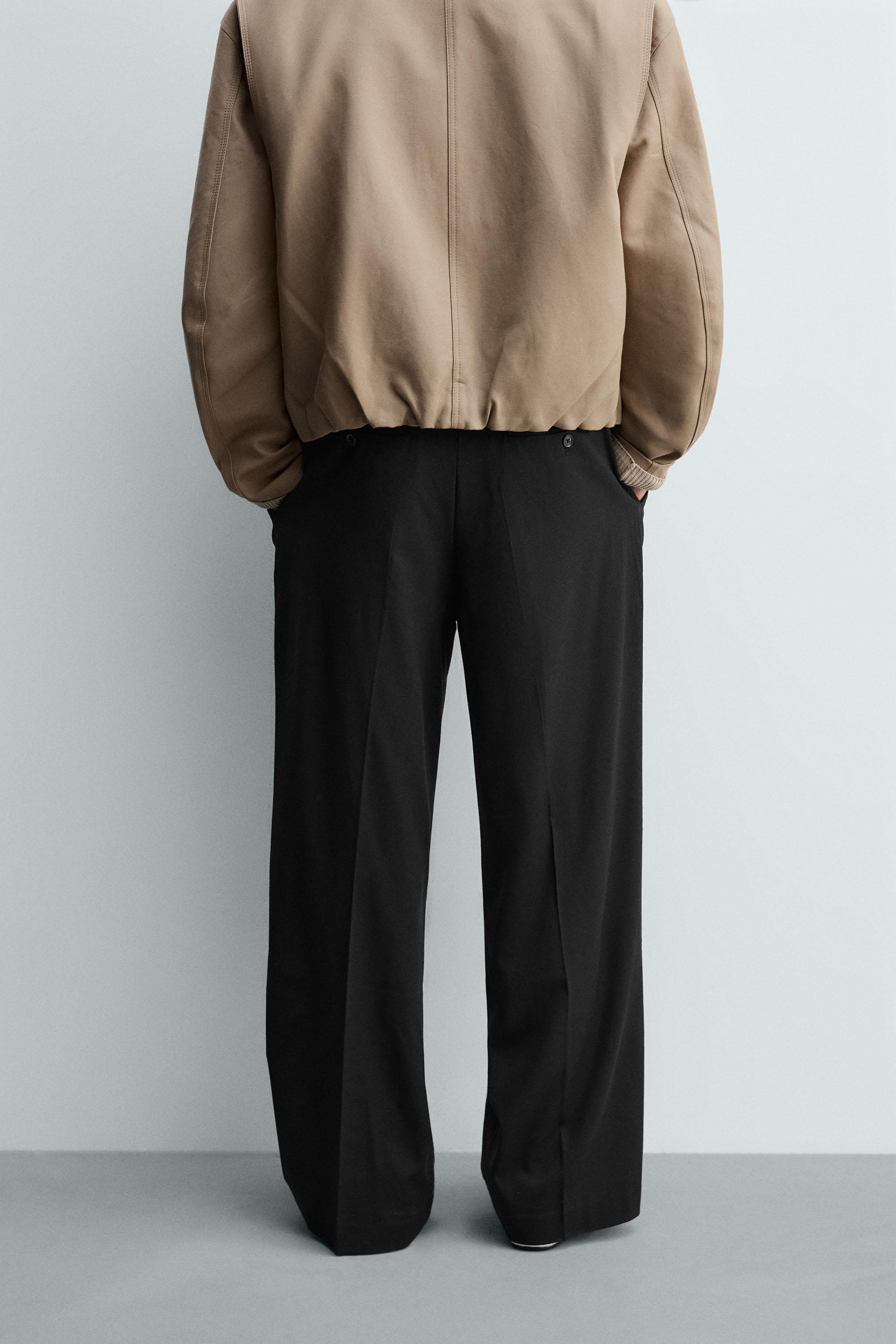 TEXTURED PLEATED PANTS