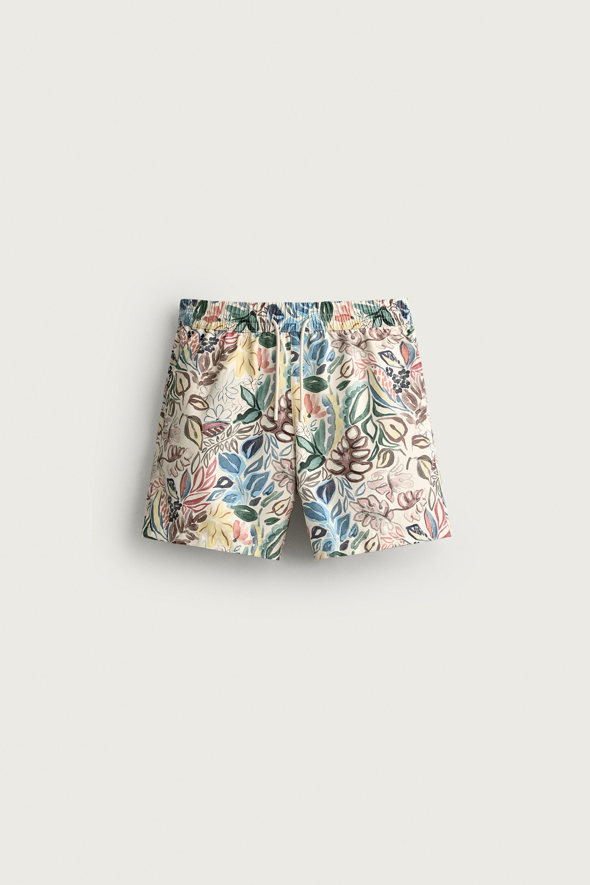 LONG FLORAL PRINT SWIM TRUNKS — Multicolored