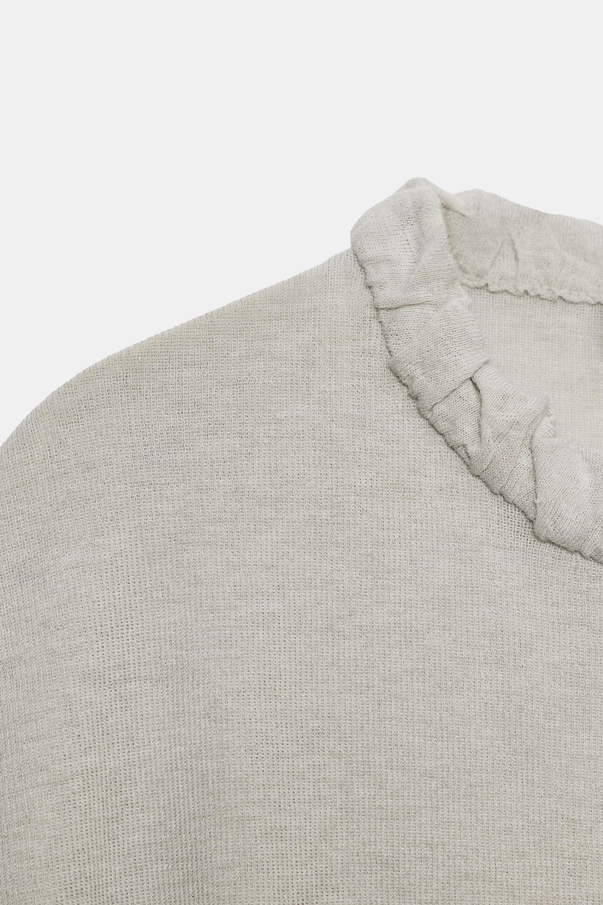 TOP EN MAILLE À COL PLISSÉ
