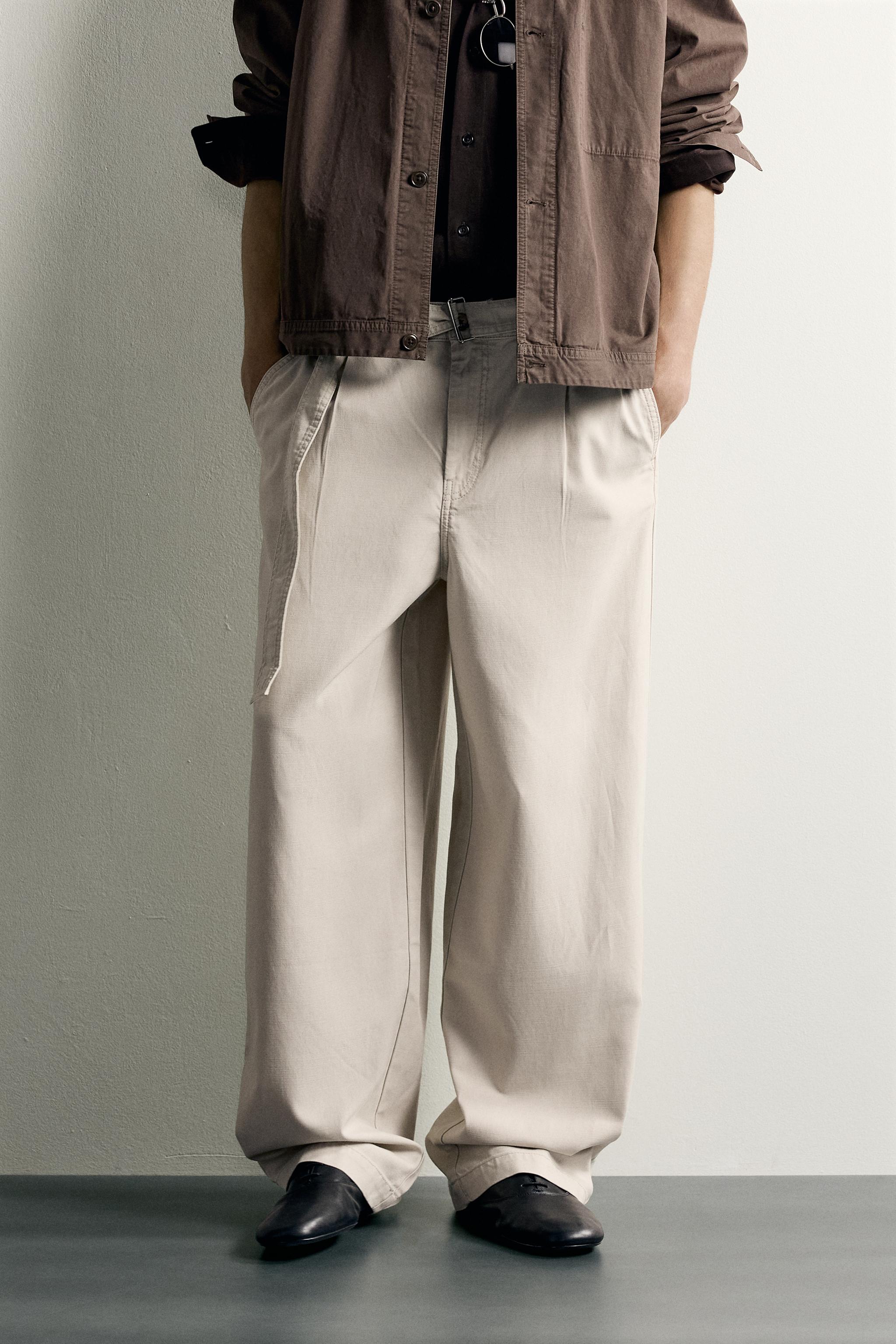 RELAXED FIT PLEATED BELTED PANTS — Light gray
