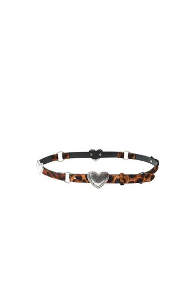 Skinny belt with animal print and silver metallic heart details on a white background.
