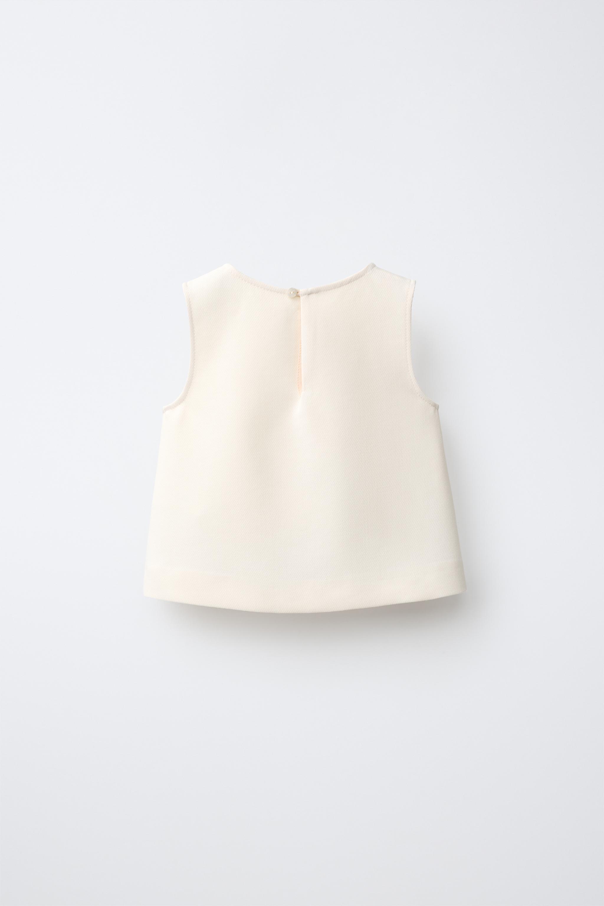 BOW APPLIQUÉ TOP