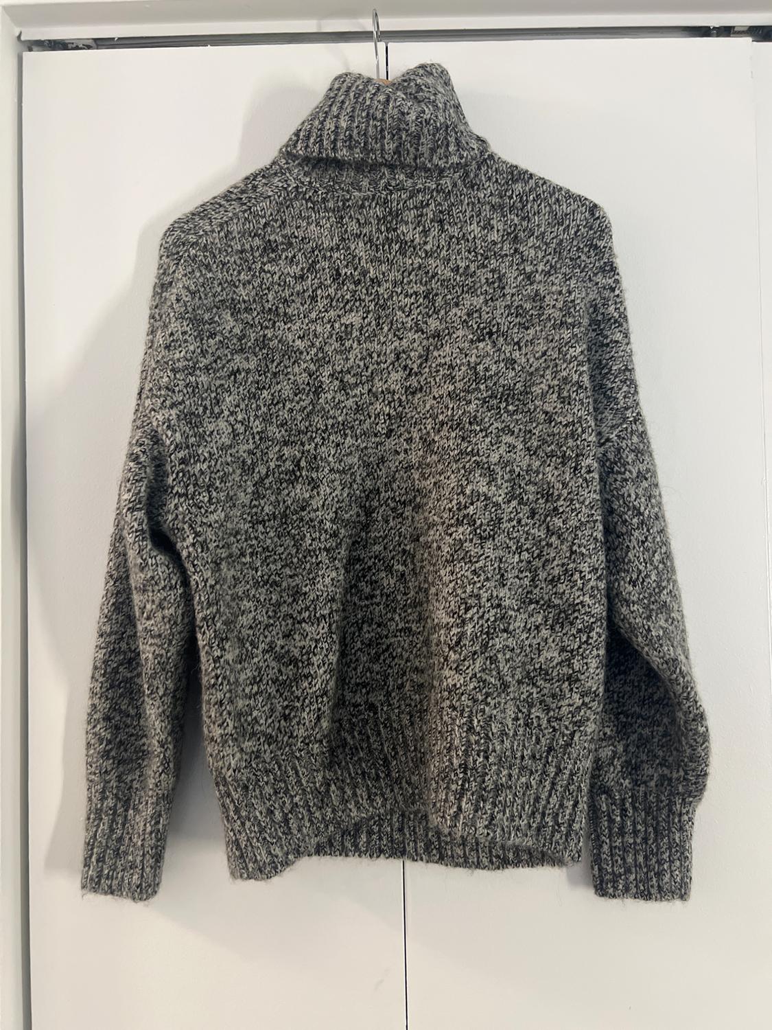 Back view of a grey marl long-sleeved high-neck sweater.