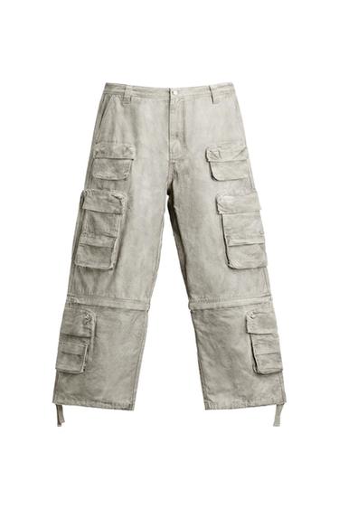 Grey cargo trousers with multiple large pockets, presented on a white background.