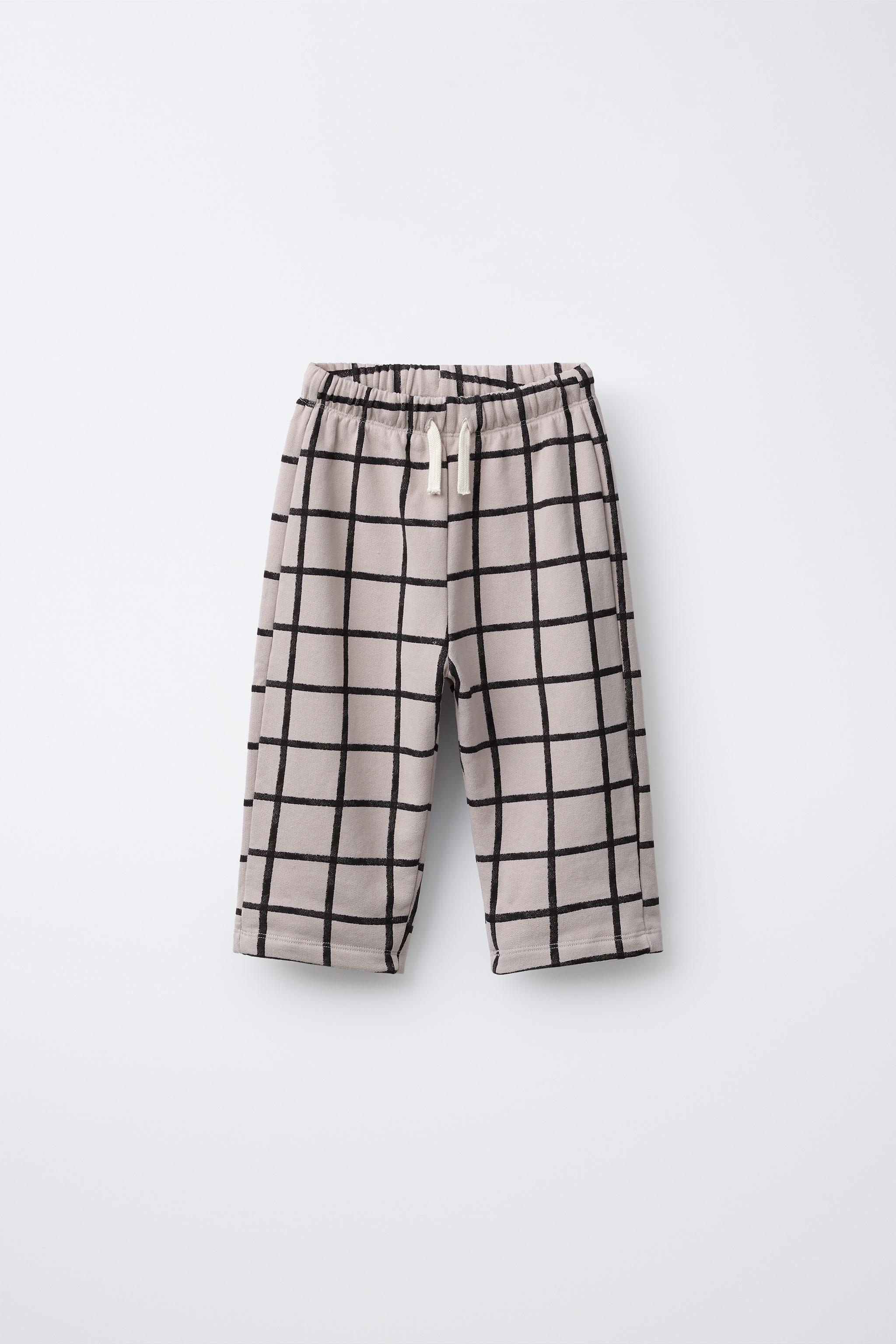 PANTALON BAGGY EN MOLLETON À CARREAUX