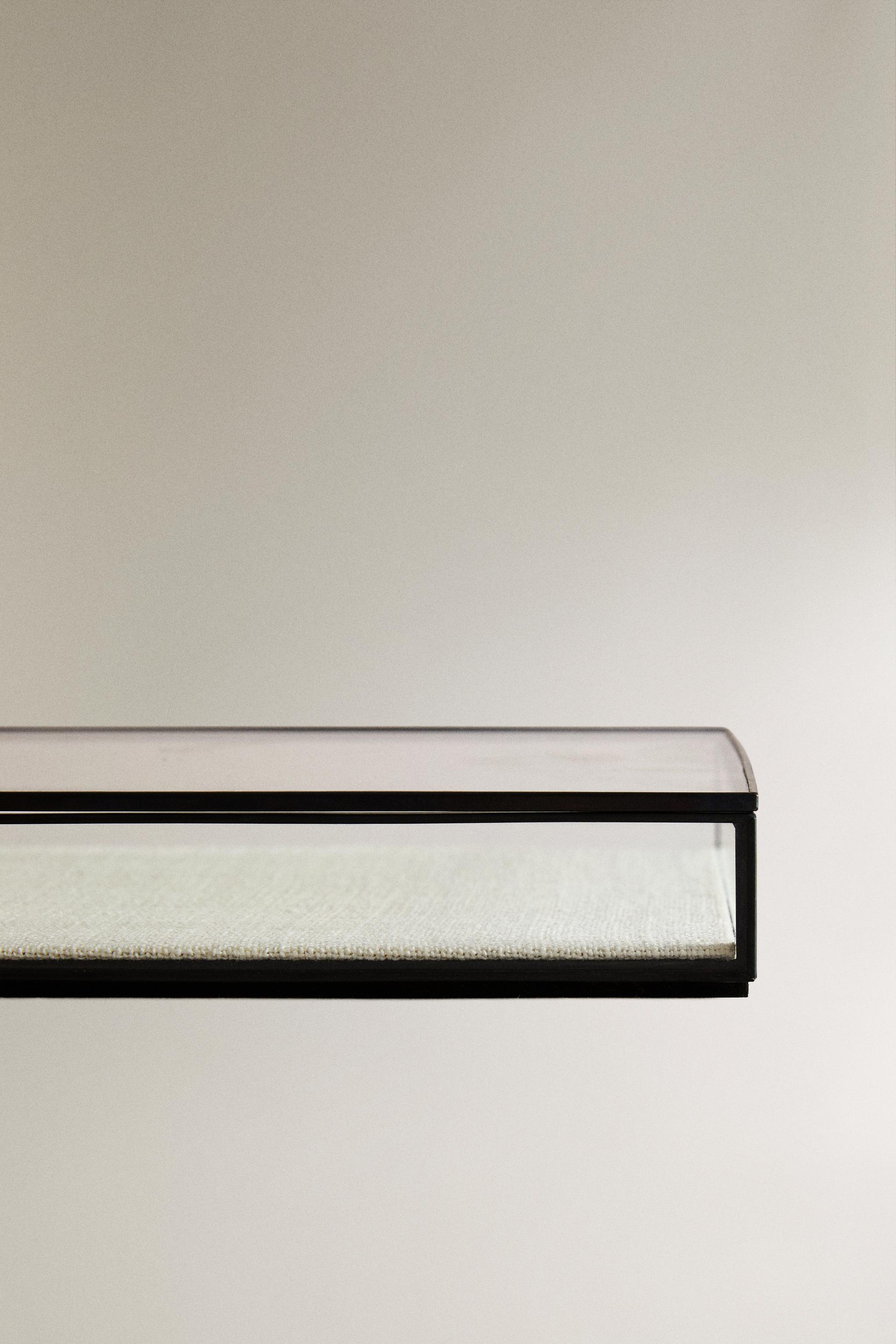 JEWELRY BOX WITH A BLACK METAL BORDER