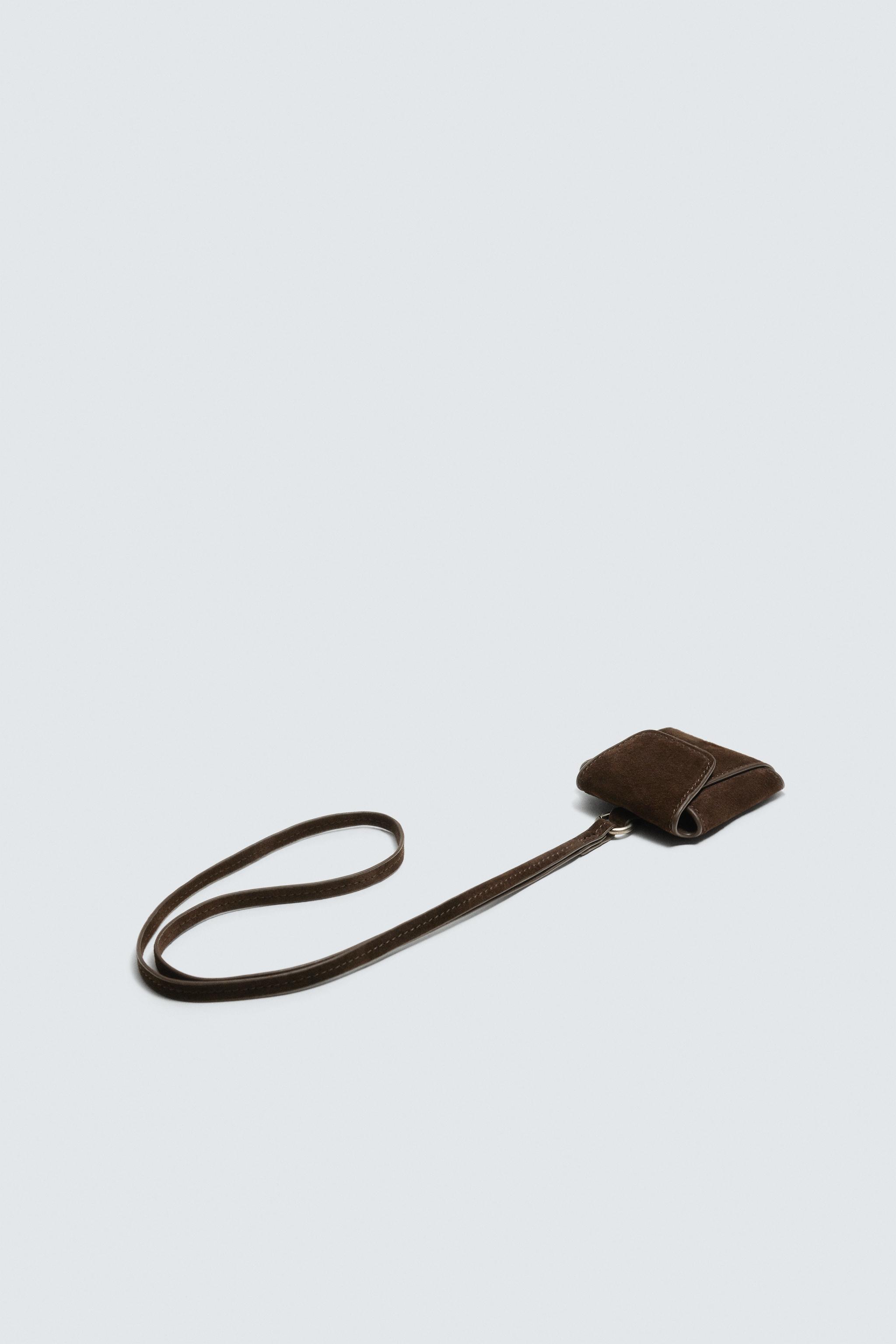 PORTE-ÉCOUTEURS EN CUIR AVEC PENDENTIF