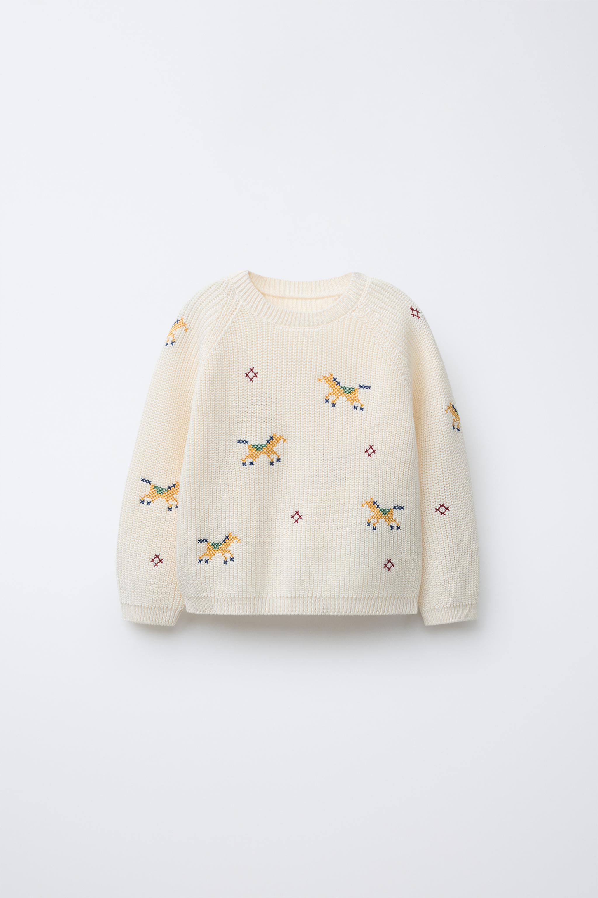 PULL EN MAILLE DÉTAILS POINT DE CROIX