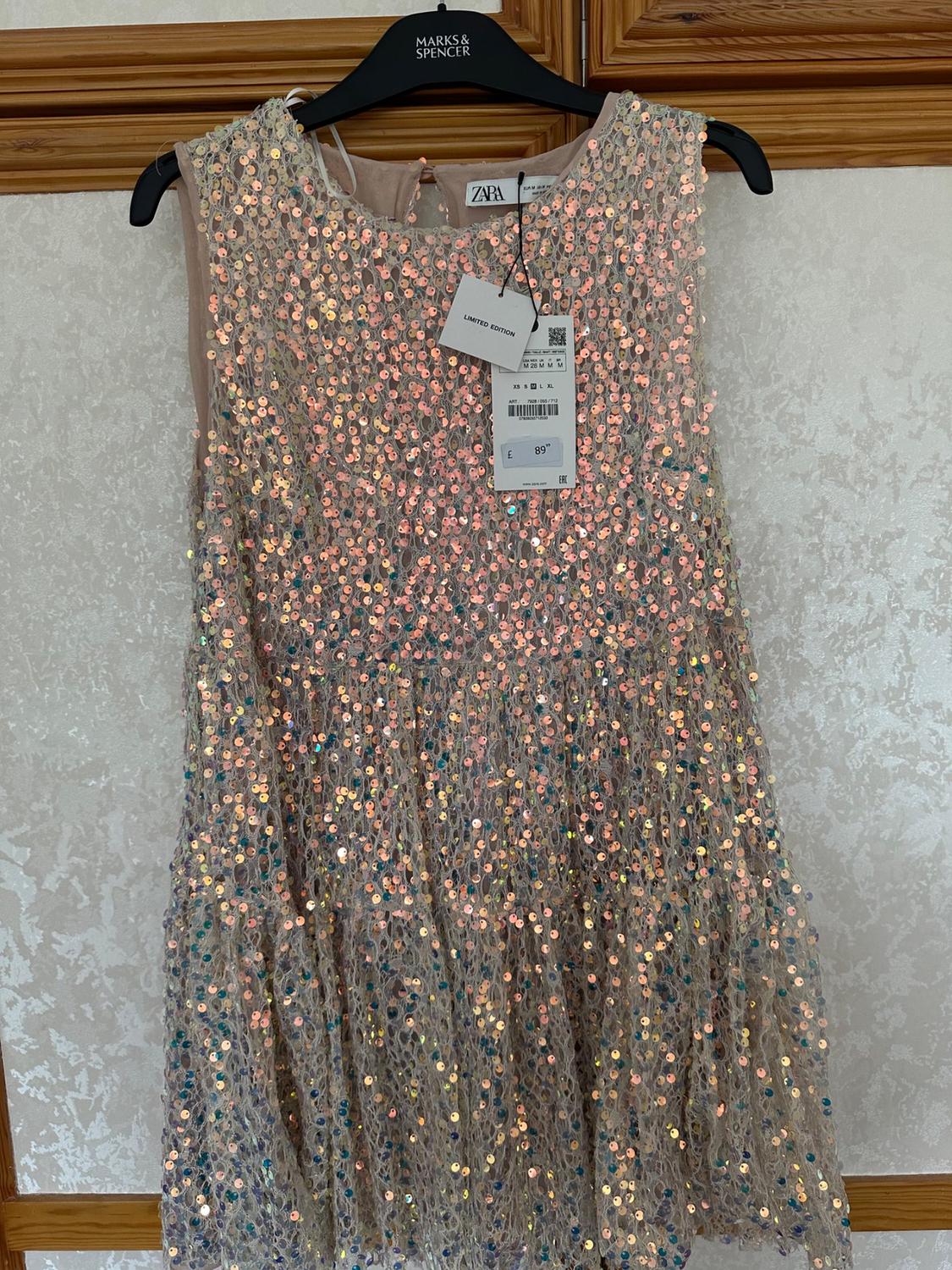 Front view of dress with multi-coloured sequins and visible label with text 'LIMITED EDITION'.