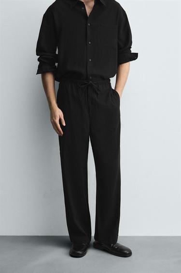 RELAXED FIT FLOWING TROUSERS - Black by Zara - Image 1