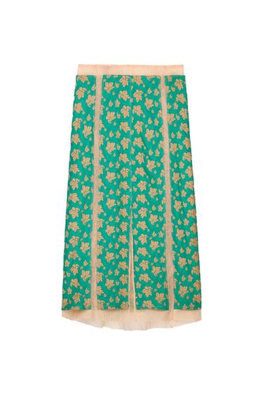Green skirt with a golden floral print and beige details on the vertical edges, on a white background.
