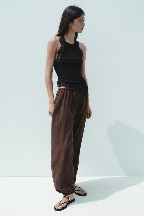 SANDALS WITH METALLIC APPLIQUÉ