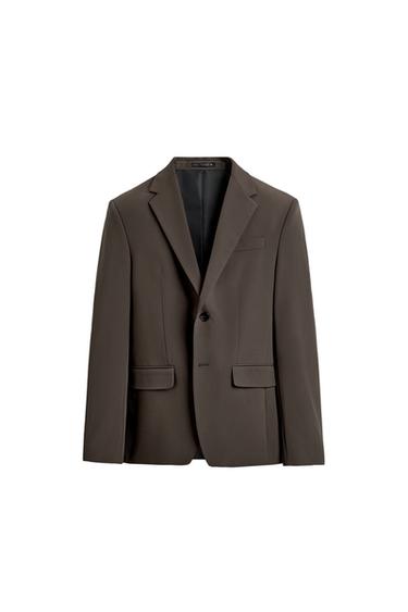 Front view of a brown jacket with a classic lapel, single-button fastening, and flap pockets.