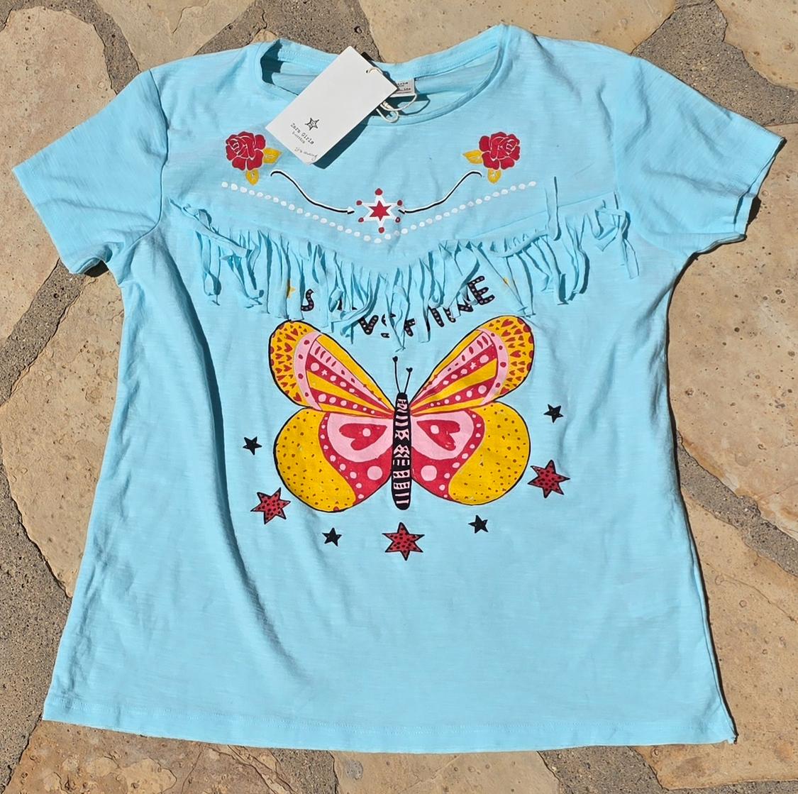 Blue t-shirt with fringe and colourful butterfly print. "STAY FINE" text and red star and flower details. Visible hang tag.