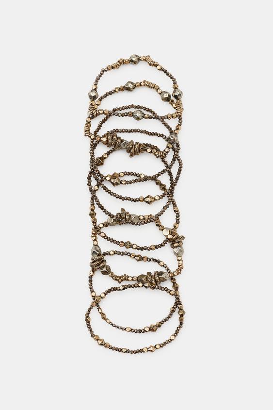 LOT DE 9 BRACELETS ÉLASTIQUES À PIÈCES VARIÉES - Or vieilli de Zara - Image 1