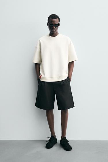 سويت شيرت INTERLOCK تقني ببطاقة - أبيض مكسور الخاص بـ Zara