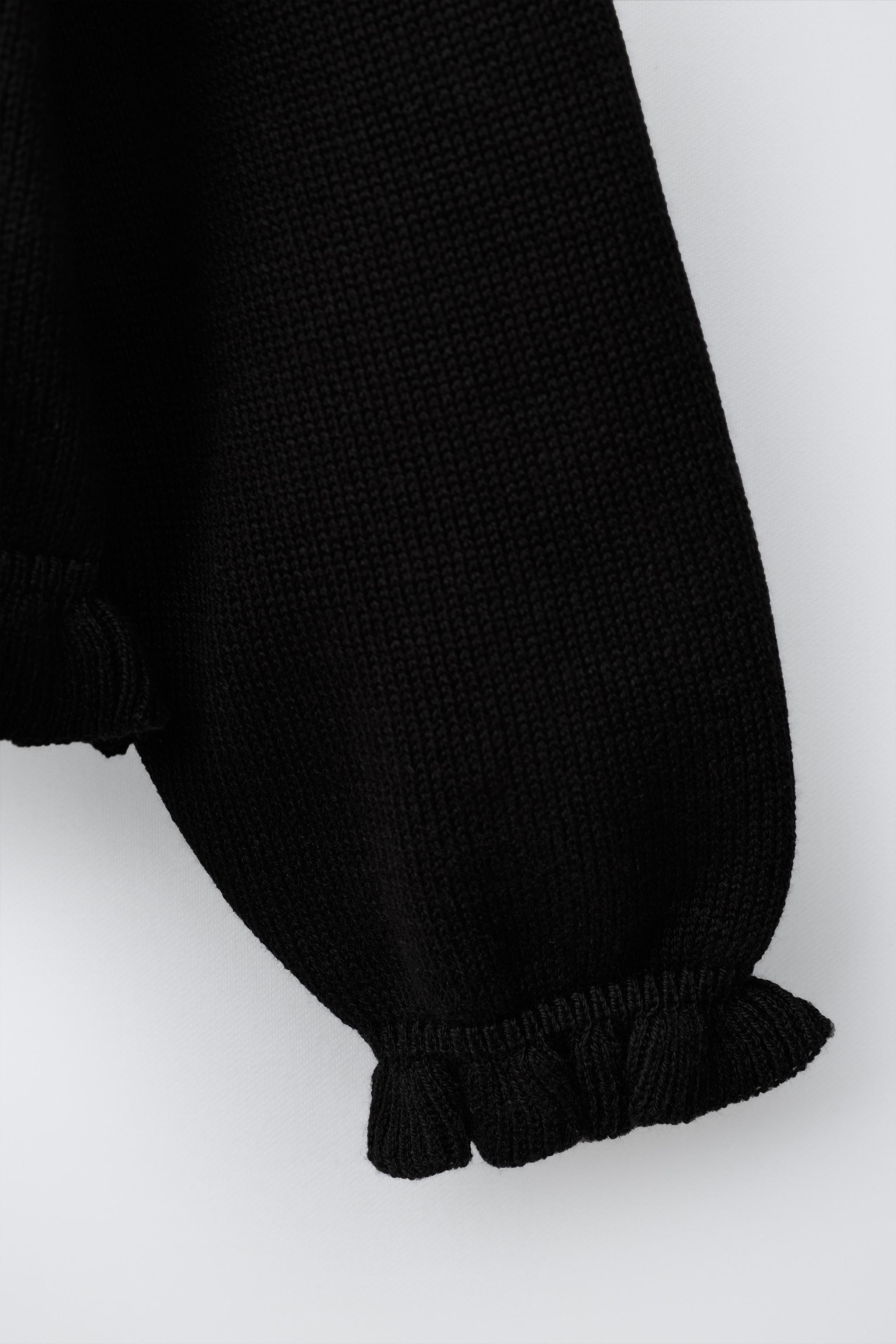 GILET EN MAILLE À PETIT VOLANT