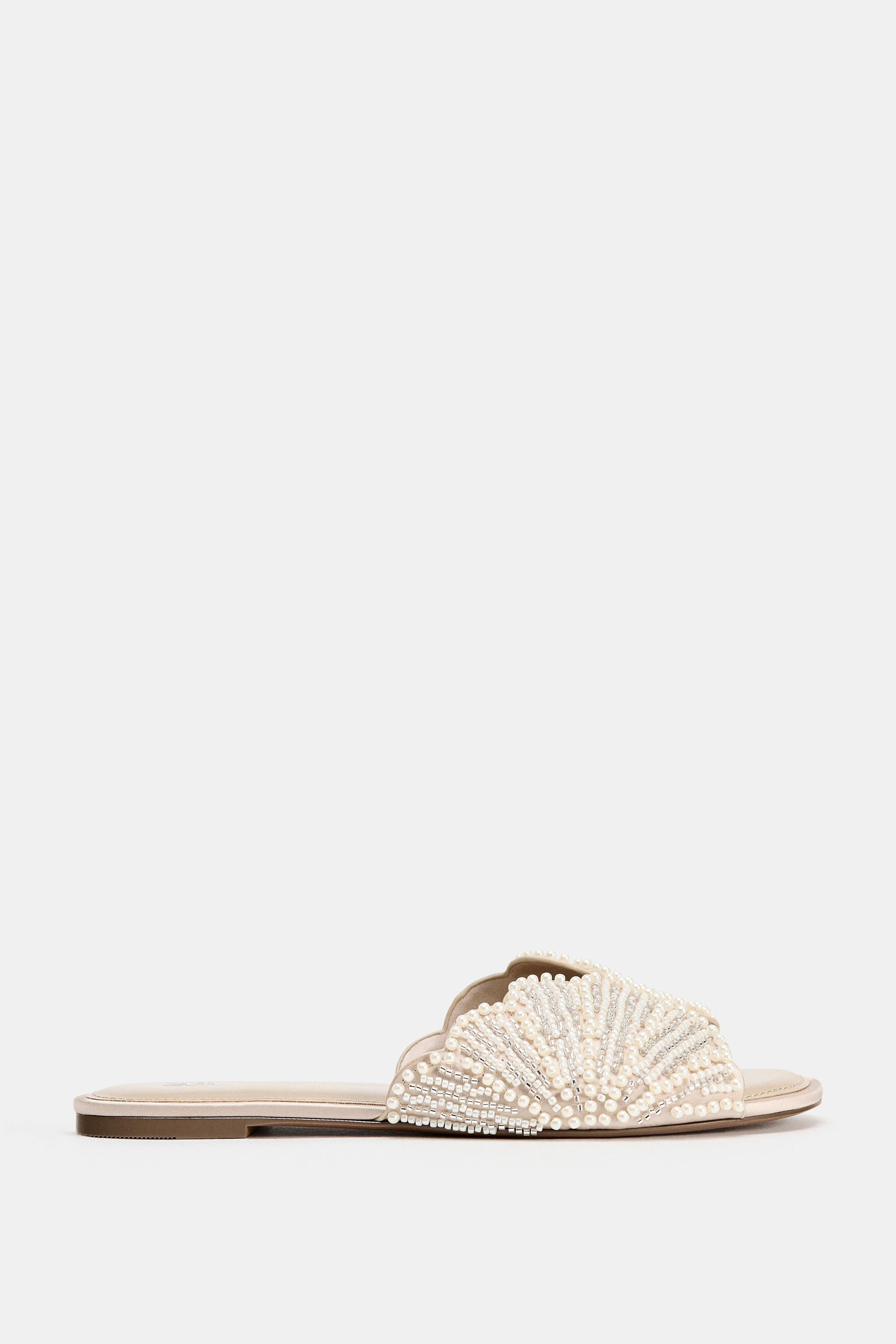FLAT SANDALS WITH SHINY APPLIQUES