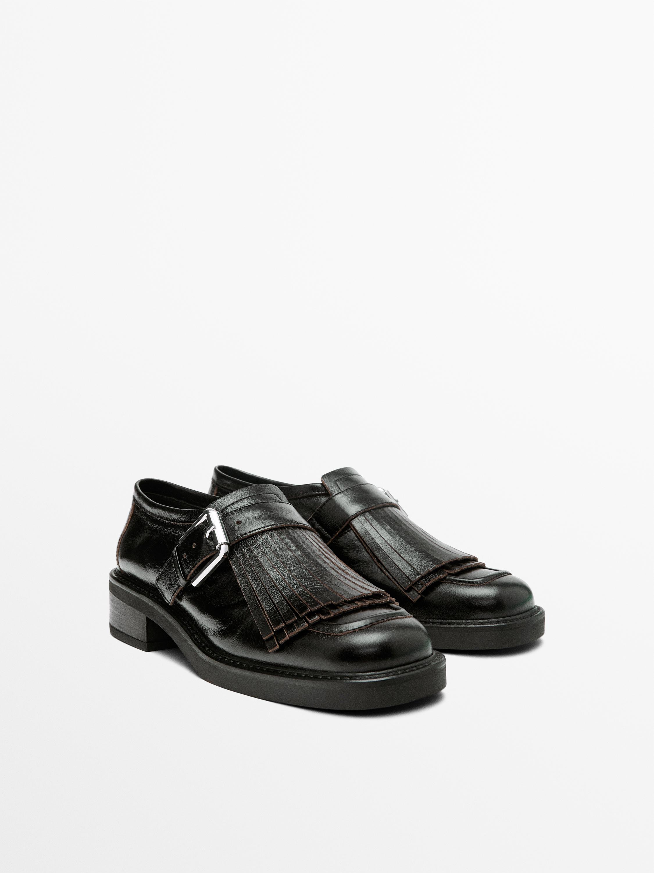 Buckled derby shoes with fringe
