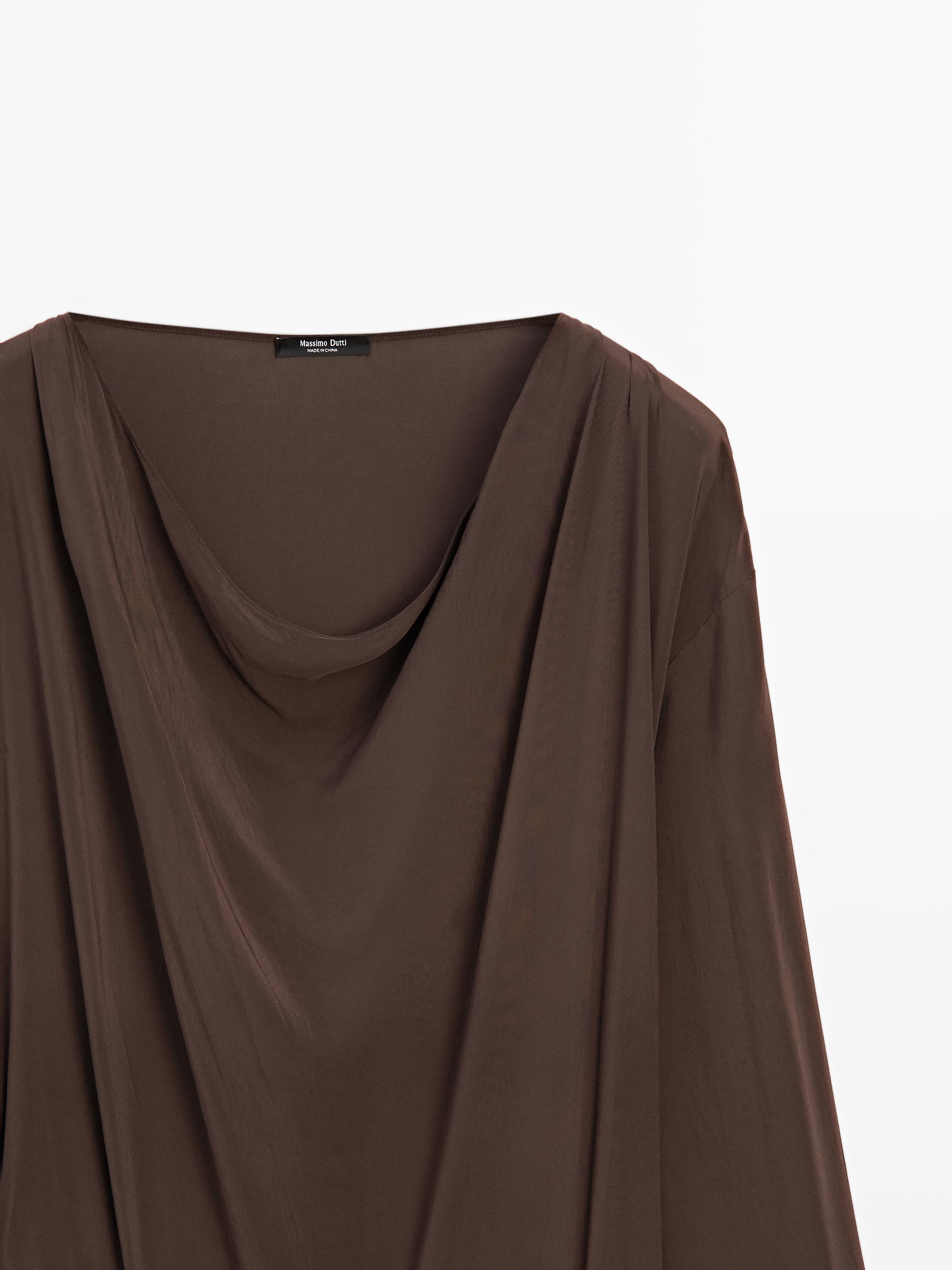 Long flowing dress with draped sash belt