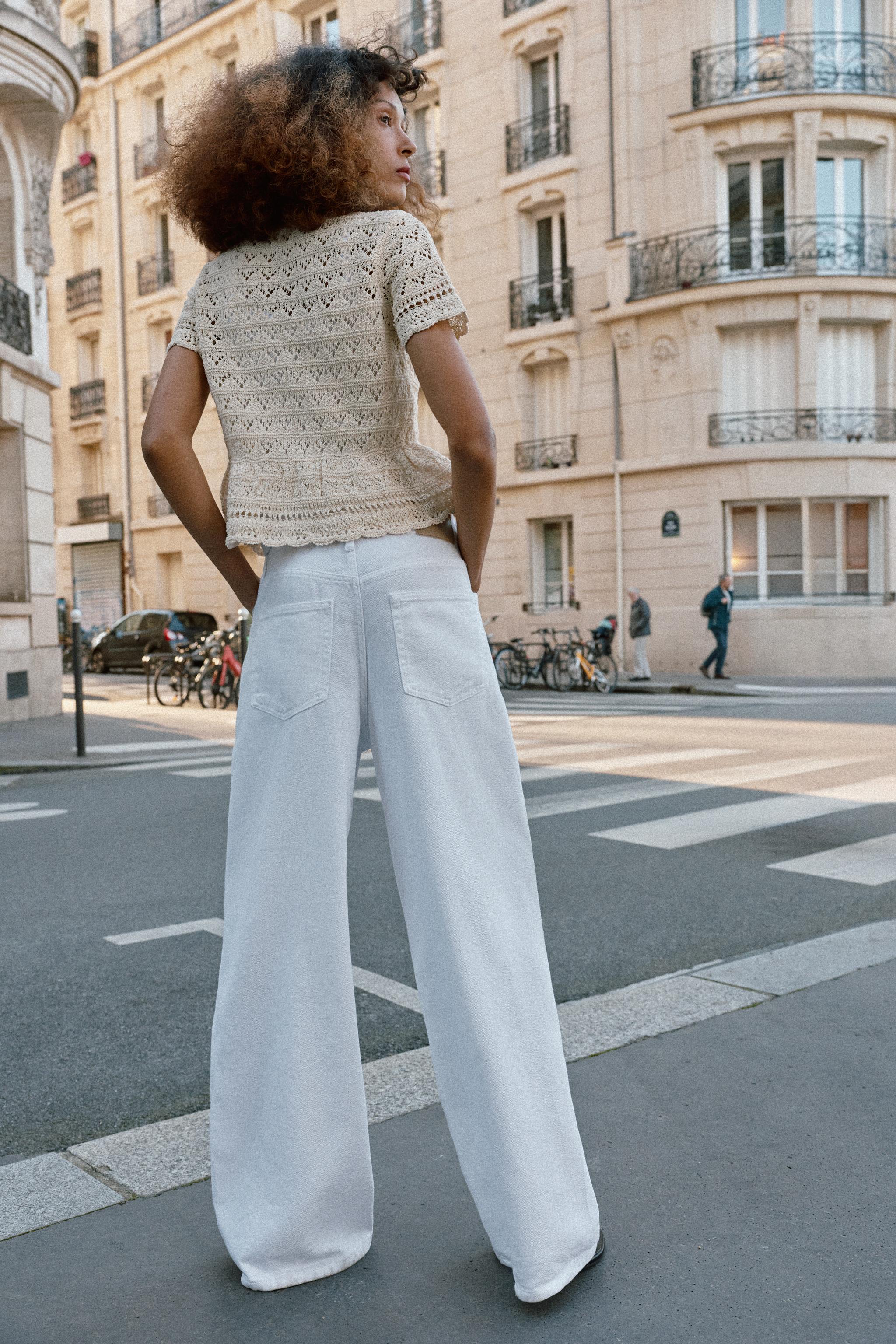 GILET EN MAILLE POINTELLE À MANCHES COURTES