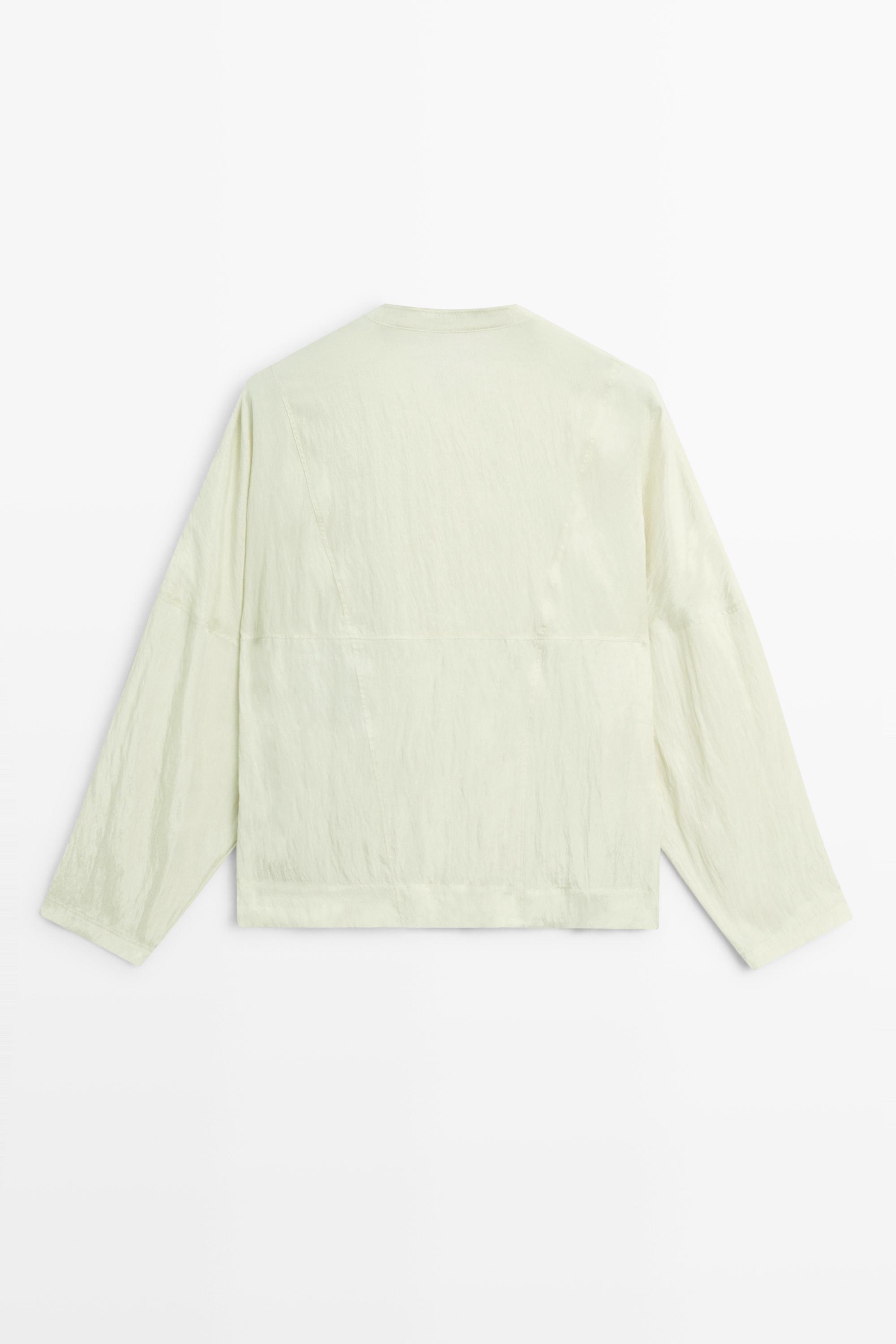 Fluid wrap shirt with button detail