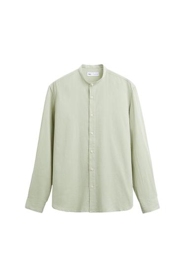 Light green long-sleeved shirt with a mandarin collar and front button closure on a white background. Label with the text ZARA on the inside.