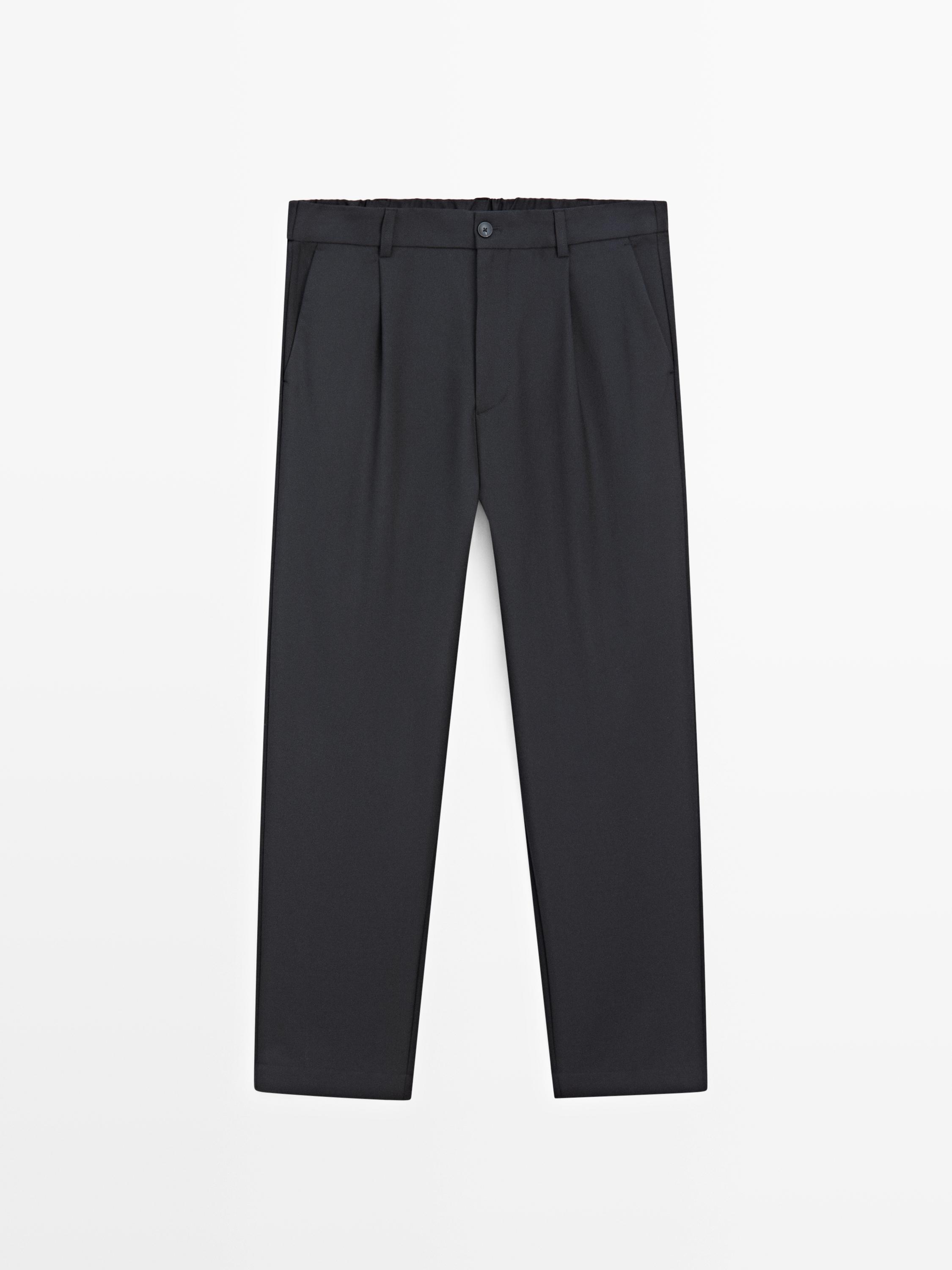 Pantalon relaxed fit à pinces en laine mélangée