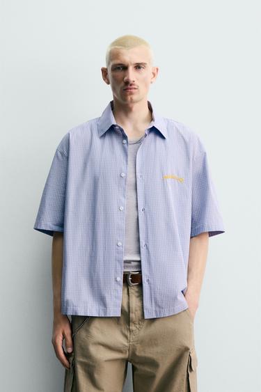 チェック柄グラフィックコントラストシャツブルーZaraのチェック柄グラフィックコントラストシャツ - ブルー 