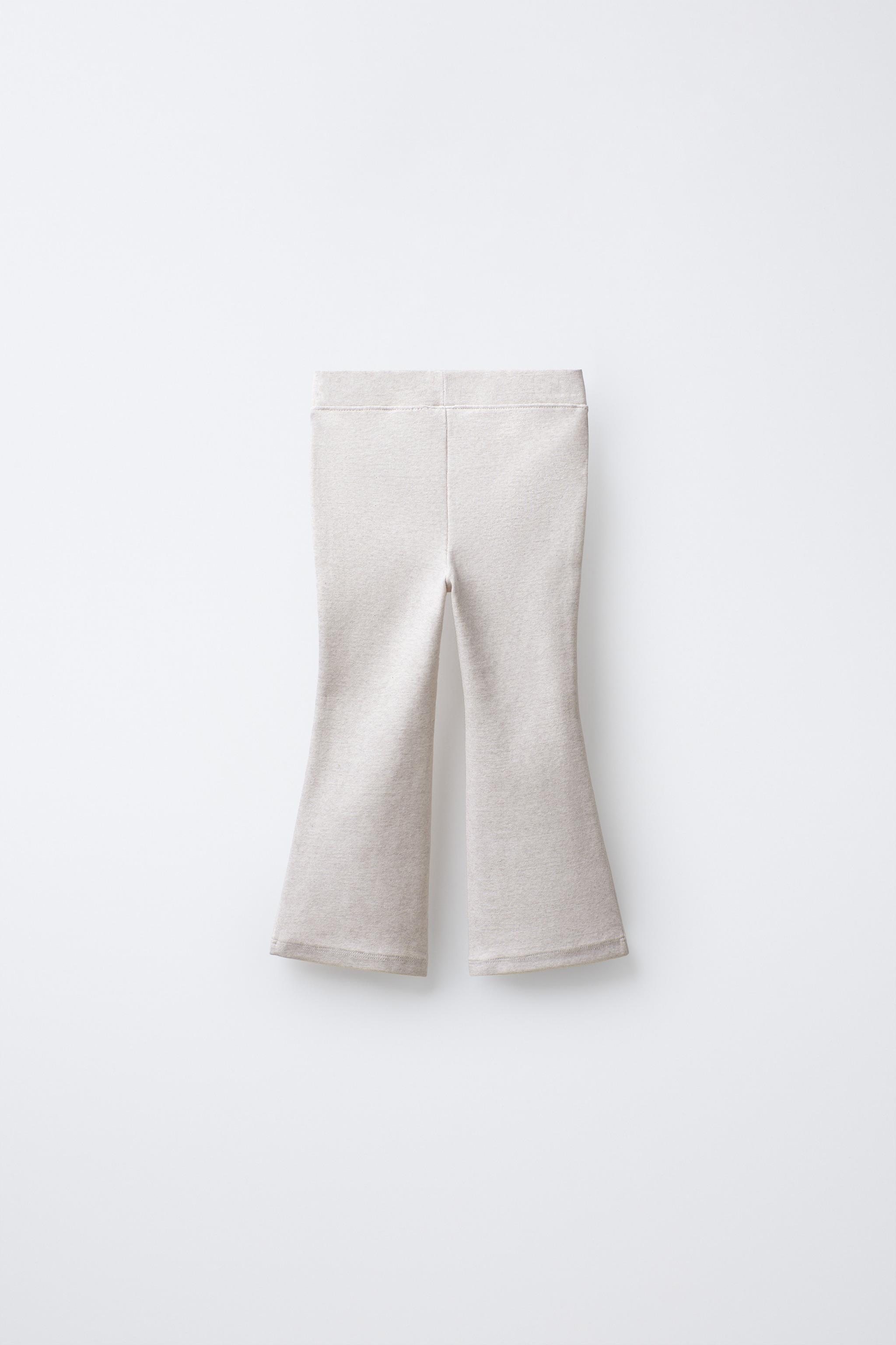 INTERLOCK FLARE LEGGINGS WITH LABEL DETAIL