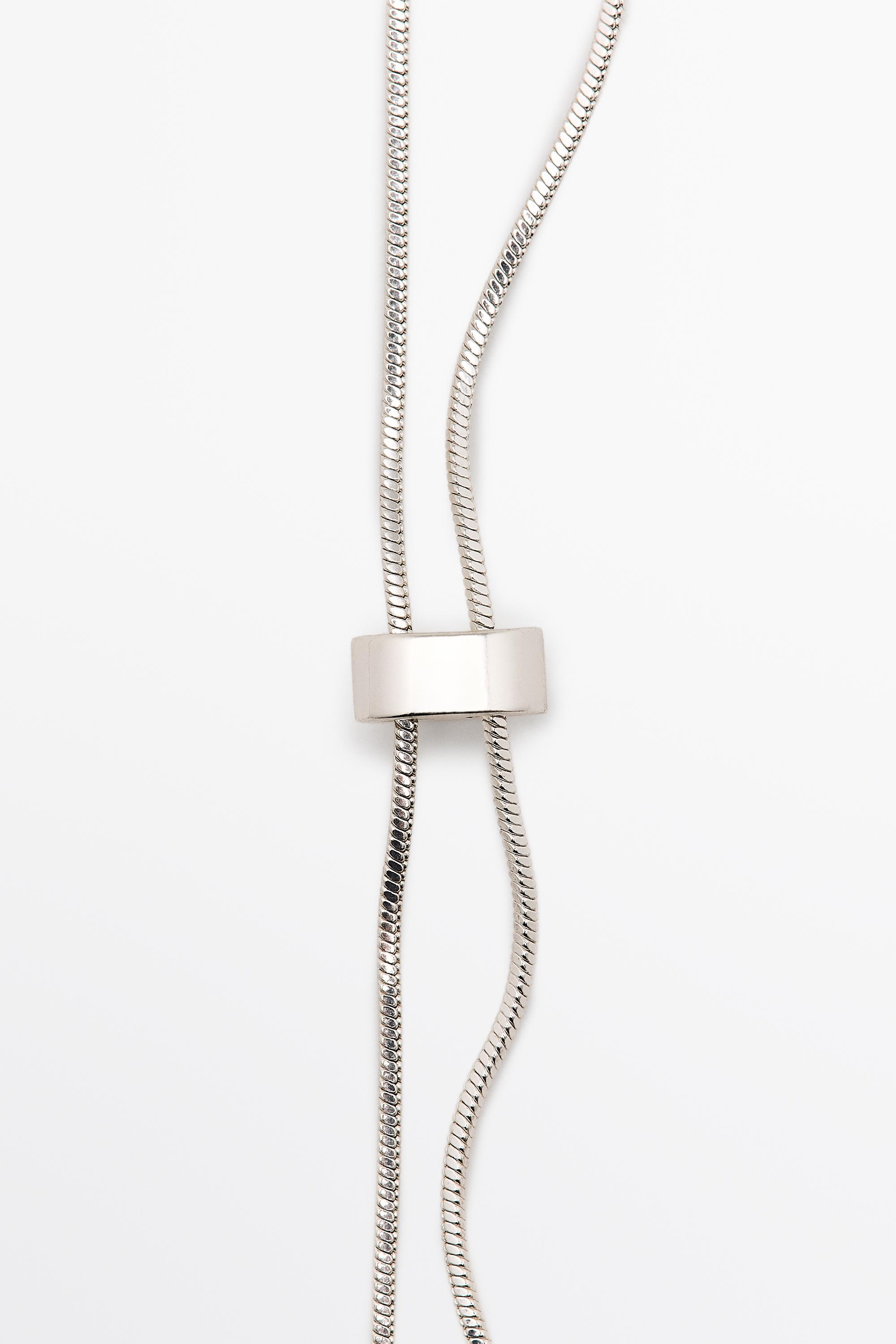 Adjustable necklace with textured pieces