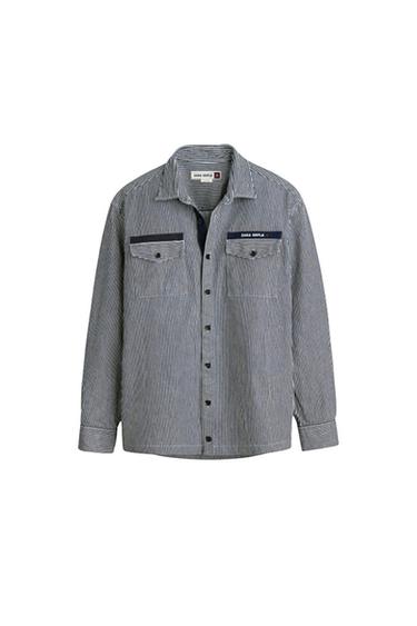 Front view of a striped shirt with front pockets and 'ZARA SIMPLE' text.