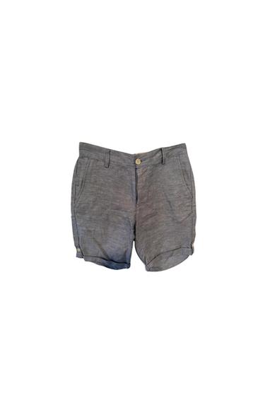 Front view of grey shorts with side pockets and a front button.