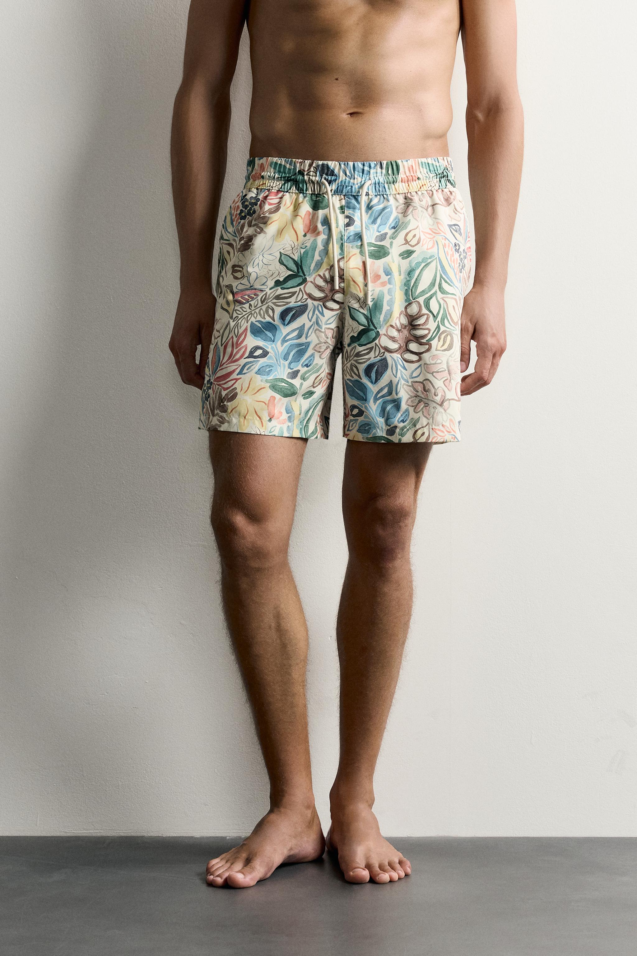 LONG FLORAL PRINT SWIM TRUNKS