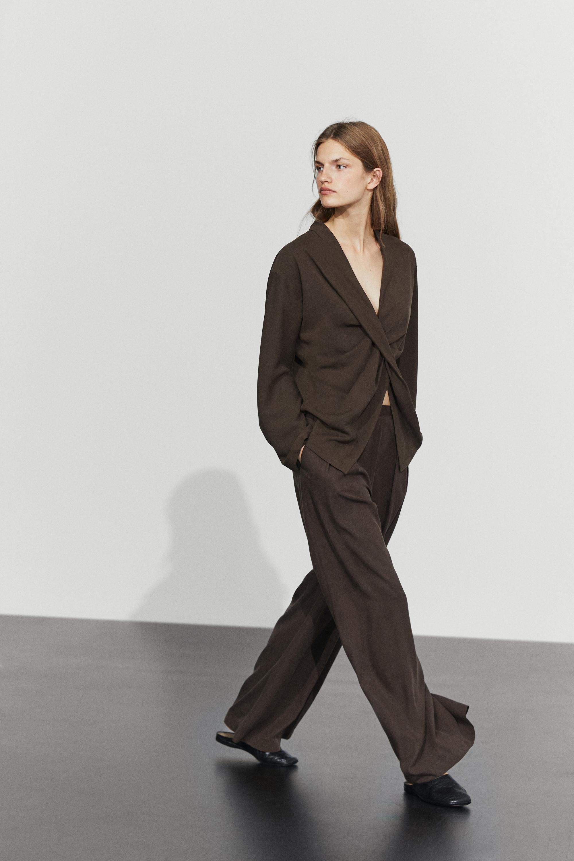 Flowing blouse with draped detail