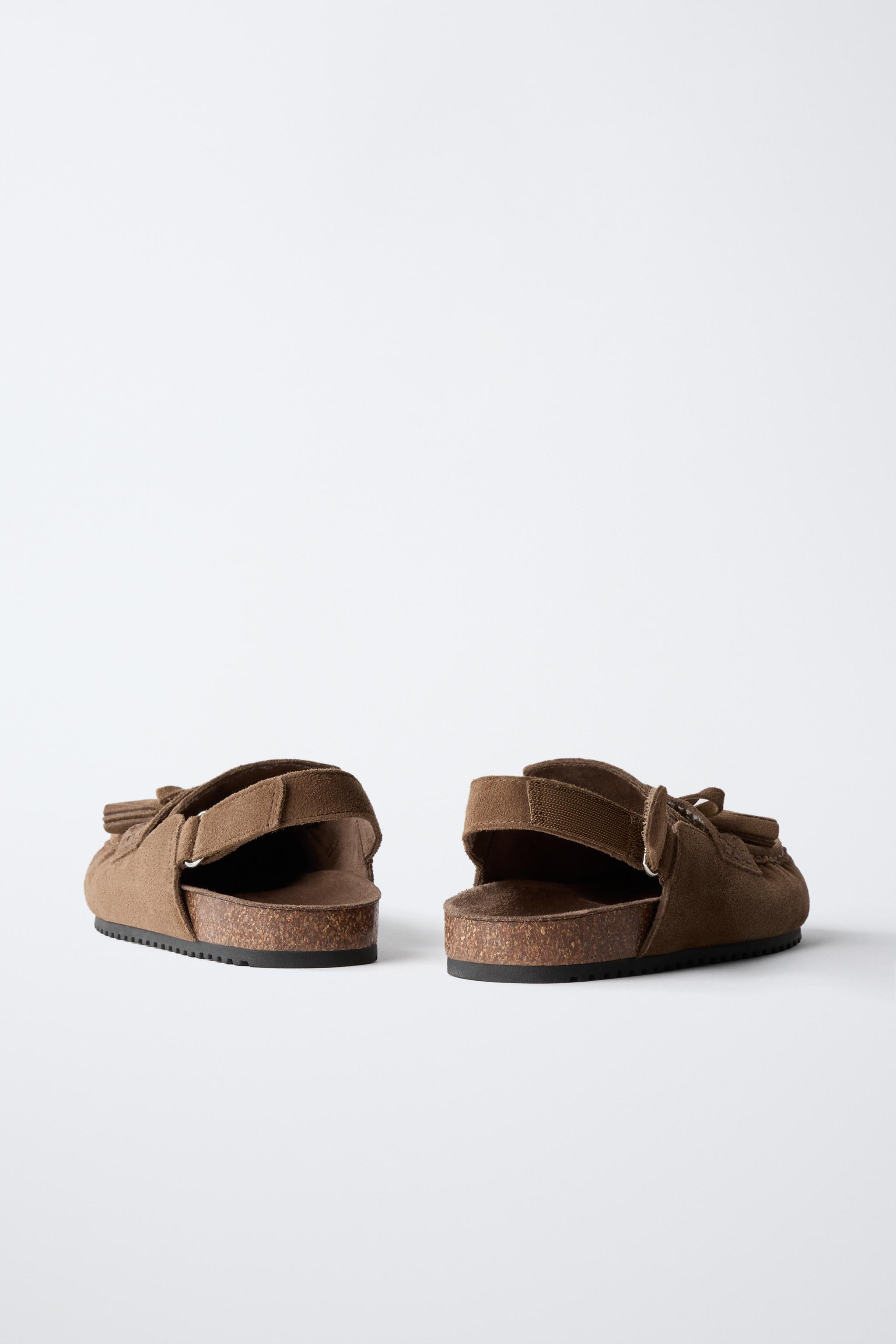 LEATHER CLOGS WITH TASSELS