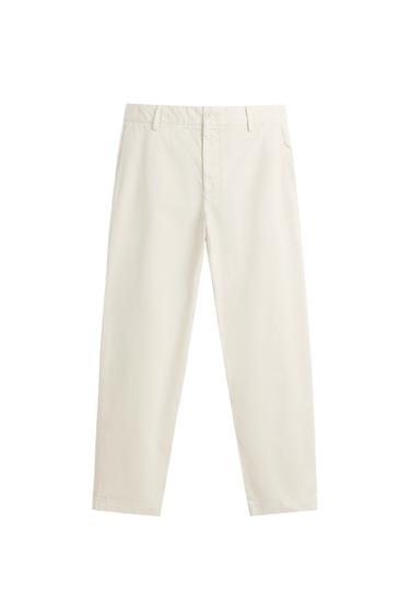 Front view of ivory chino trousers, regular fit, front and back jetted pockets with button, front zip and button fastening.